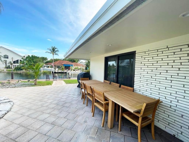 view of patio featuring a water view