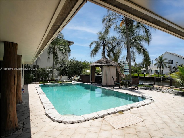 view of pool featuring a gazebo and a patio