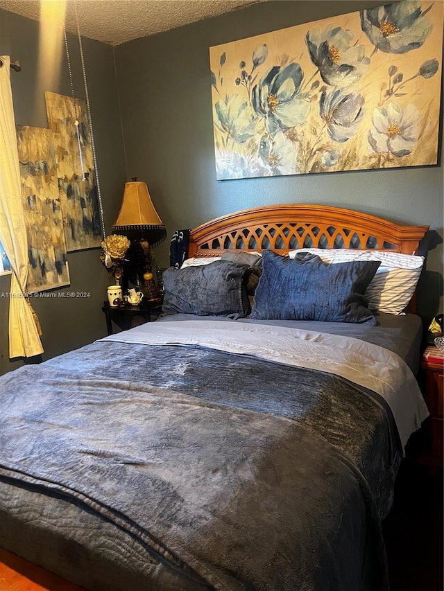 bedroom featuring a textured ceiling