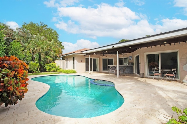 view of pool featuring ceiling fan and a patio area