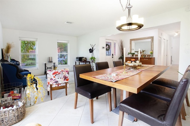 dining room with light tile patterned flooring