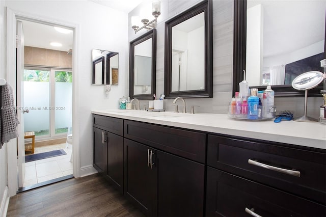 bathroom featuring hardwood / wood-style floors, vanity, and toilet