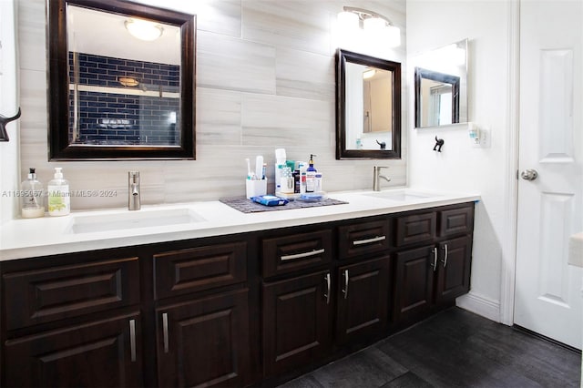 892 NW 83rd Dr, Coral Springs, FL 33071 - bathroom featuring tasteful backsplash, double vanity, and wood finished floors