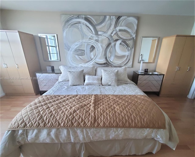 bedroom with light wood-type flooring