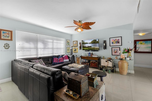 living room featuring ceiling fan and light tile patterned flooring