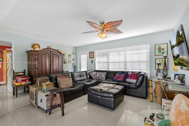 tiled living room featuring ceiling fan