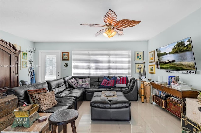 living room featuring ceiling fan and light tile patterned floors