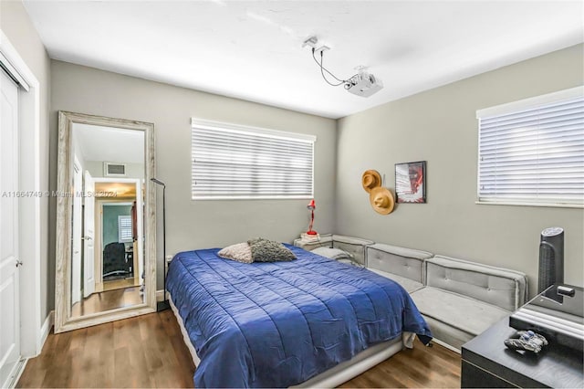 bedroom featuring dark hardwood / wood-style floors