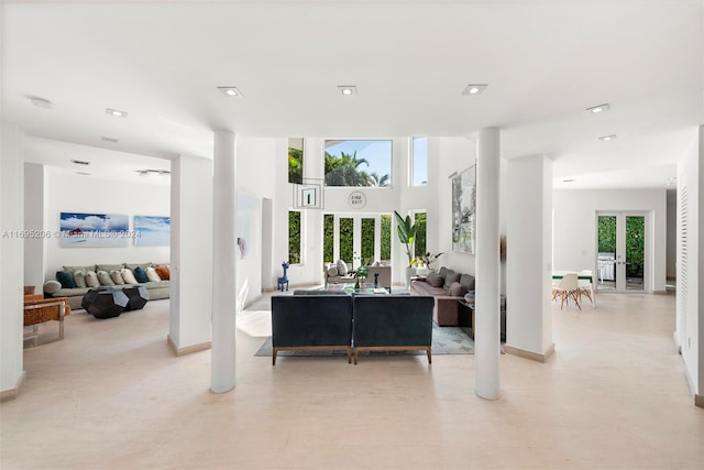 living room featuring plenty of natural light and french doors