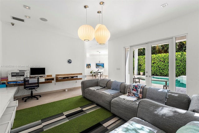 carpeted living room with french doors