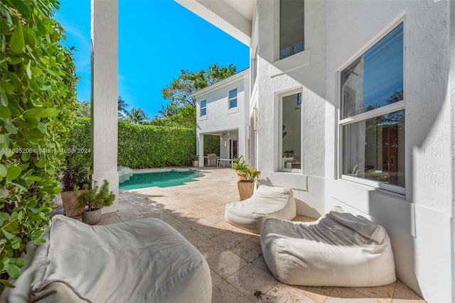 view of pool featuring a patio area