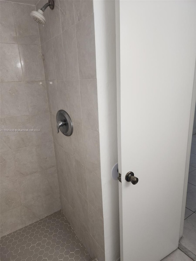 bathroom with tiled shower