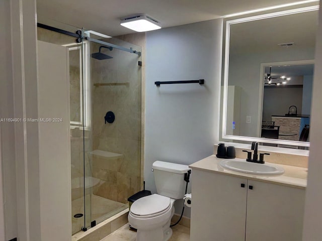 bathroom with tile patterned flooring, vanity, toilet, and walk in shower