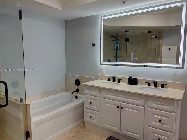 bathroom featuring tile patterned flooring, vanity, and separate shower and tub