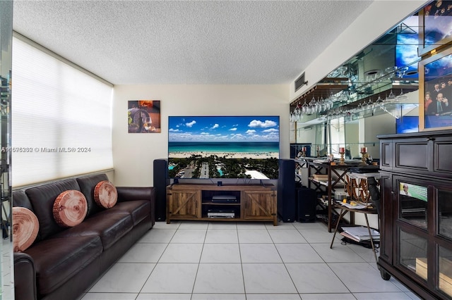 tiled living room with a textured ceiling