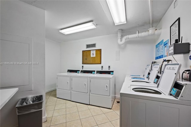 washroom with light tile patterned flooring and independent washer and dryer