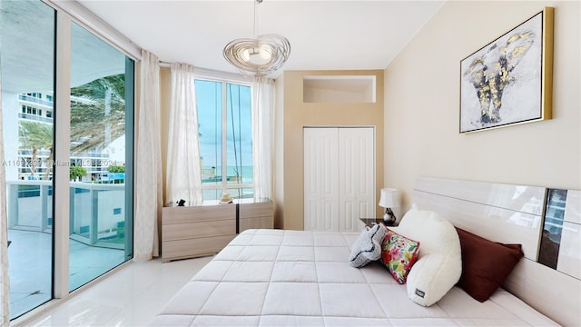 15811 Collins Ave Unit 504, Sunny Isles Beach, FL 33160 - bedroom featuring access to exterior, a closet, and tile patterned floors