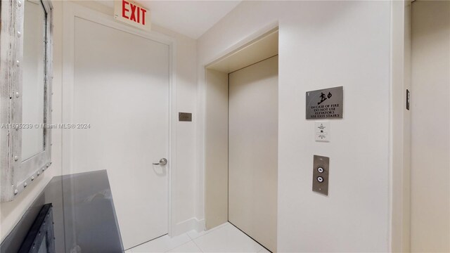 15811 Collins Ave Unit 504, Sunny Isles Beach, FL 33160 - bathroom featuring elevator and tile patterned flooring