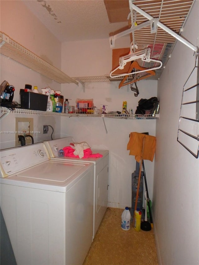 laundry room with carpet and washing machine and dryer