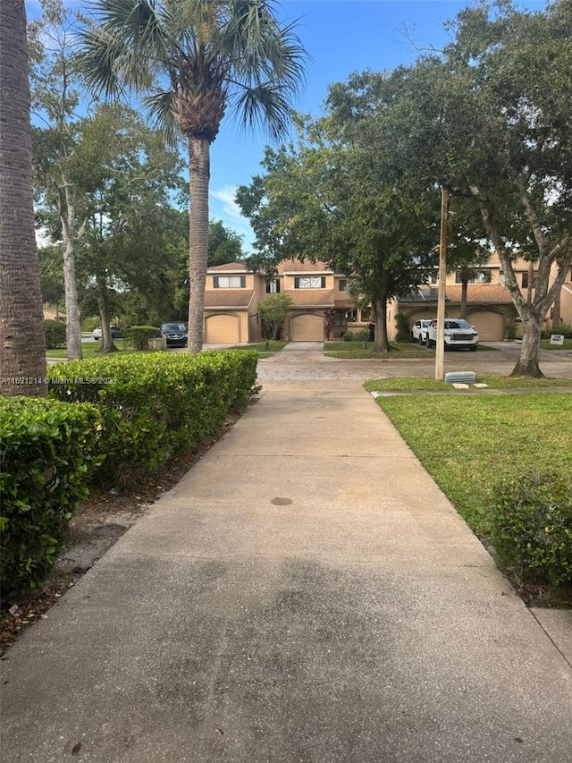 view of front of house with a garage and a front lawn