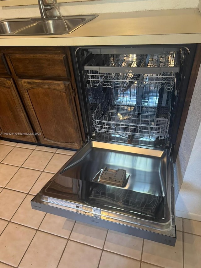 details featuring sink, dark brown cabinetry, and dishwasher