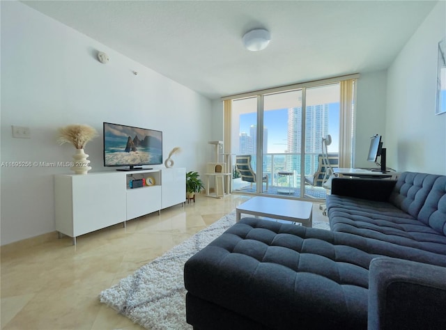 living room featuring floor to ceiling windows