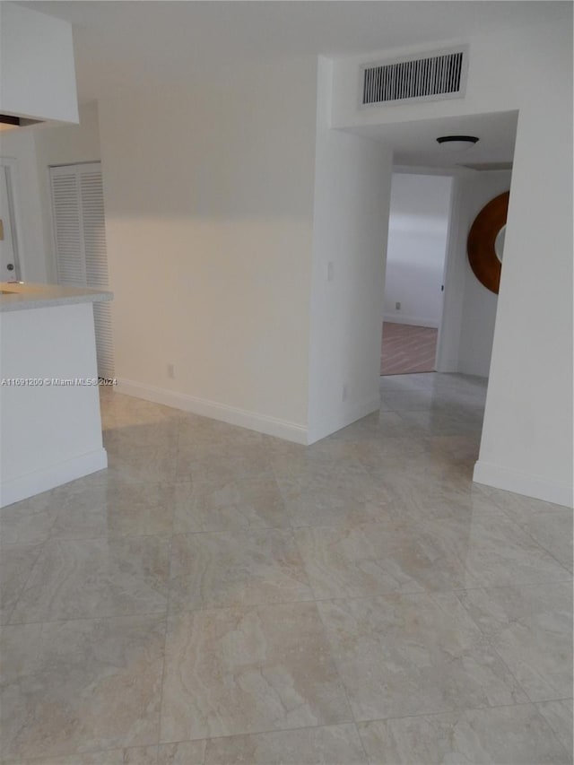 5051 W Oakland Park Blvd Unit 302, Lauderdale Lakes, FL 33313 - unfurnished living room with baseboards