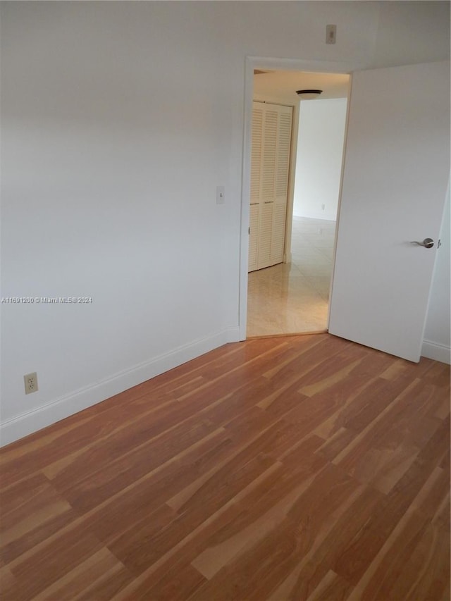 empty room featuring hardwood / wood-style floors