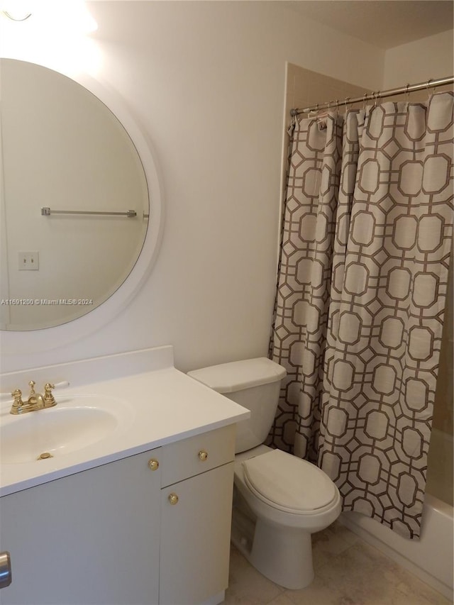 full bathroom with shower / tub combo, vanity, toilet, and tile patterned floors