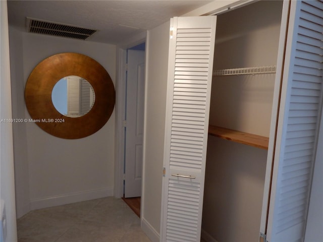 5051 W Oakland Park Blvd Unit 302, Lauderdale Lakes, FL 33313 - hall with baseboards and tile patterned flooring