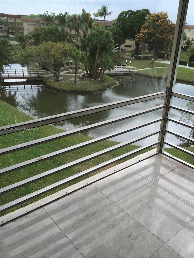 balcony featuring a water view