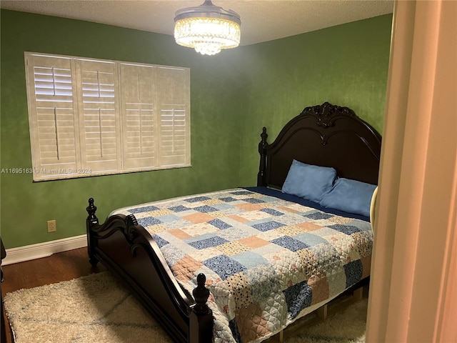 bedroom featuring dark hardwood / wood-style floors