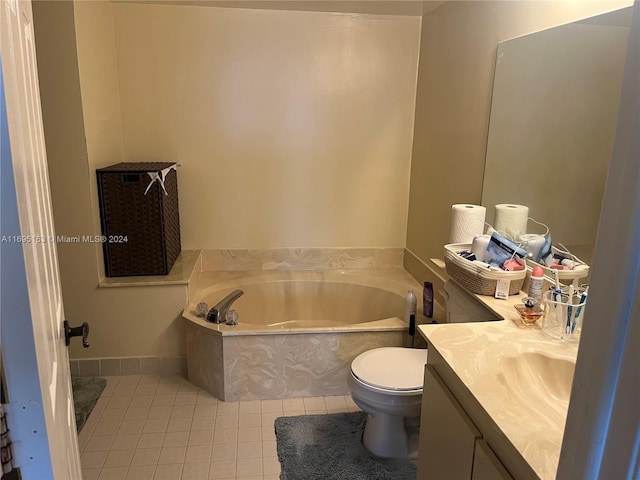 bathroom featuring tile patterned floors, a washtub, vanity, and toilet