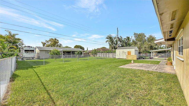 view of yard featuring a shed and a patio