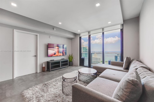 living room featuring floor to ceiling windows