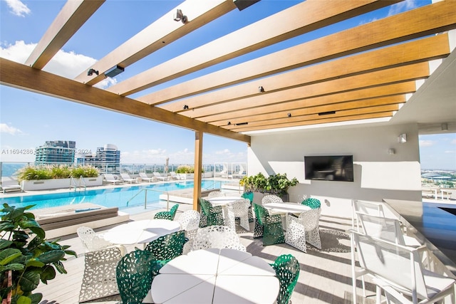 view of patio featuring a pergola and a community pool