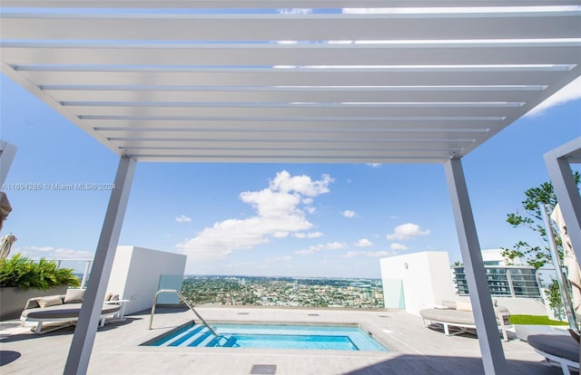 view of pool featuring an in ground hot tub