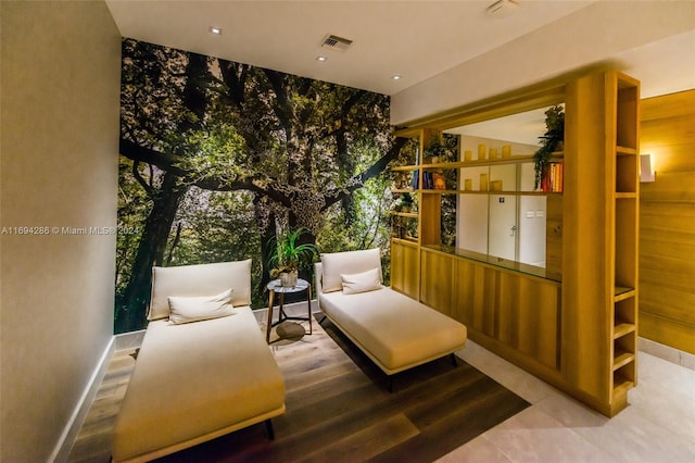 sitting room with hardwood / wood-style floors