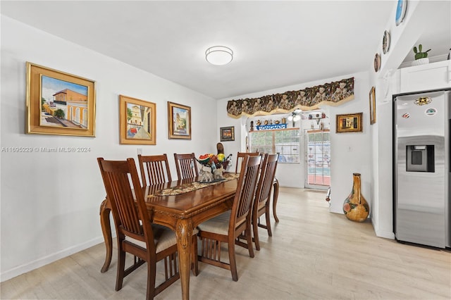 dining space with light wood-type flooring