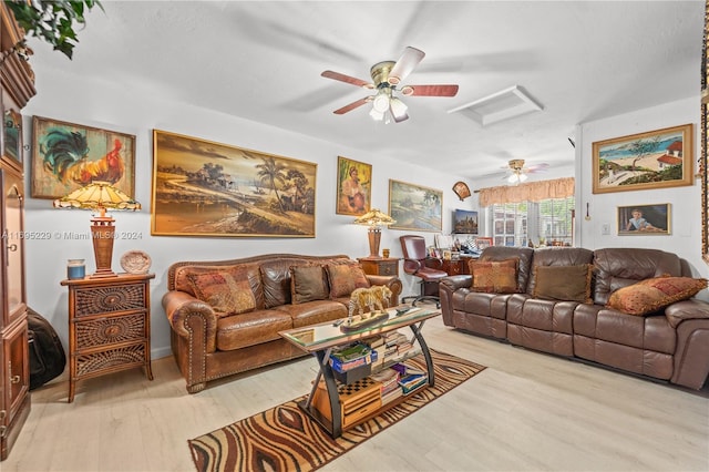 living room with ceiling fan and light wood-type flooring