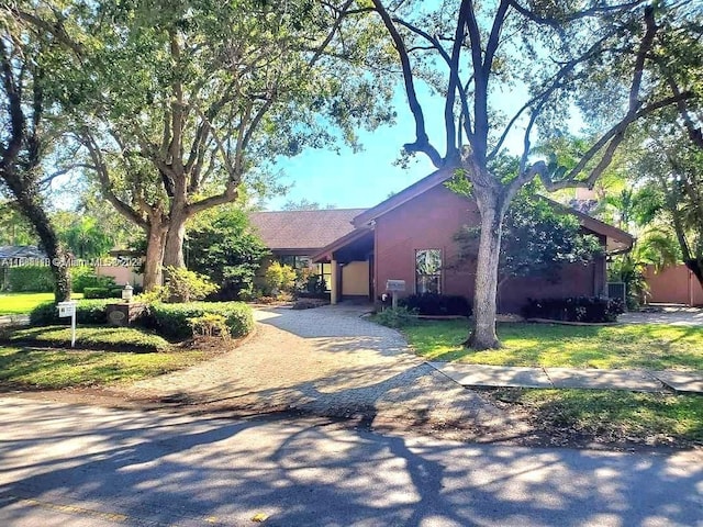 view of side of property with a lawn