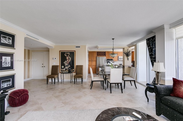 living room featuring a textured ceiling and crown molding