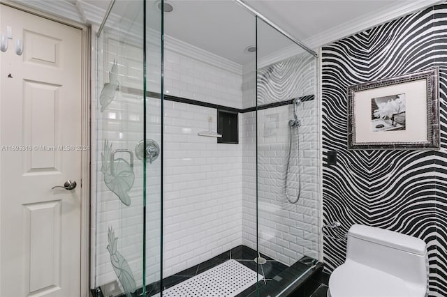 bathroom featuring crown molding, a shower with door, and toilet