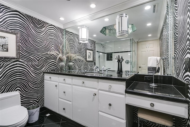 bathroom featuring an enclosed shower, vanity, toilet, and crown molding