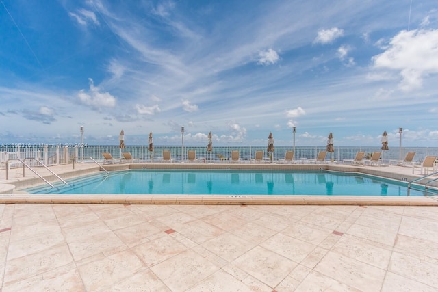 view of swimming pool with a patio area