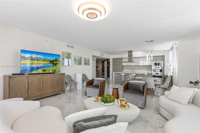 living room with marble finish floor and visible vents