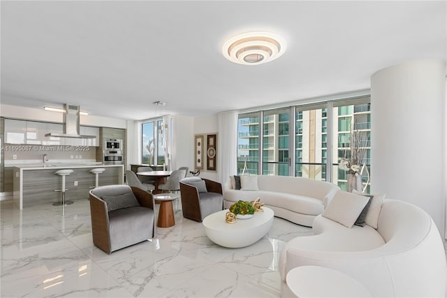 living area featuring marble finish floor