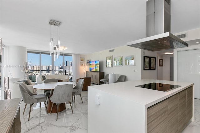 kitchen with visible vents, island range hood, open floor plan, marble finish floor, and black electric cooktop