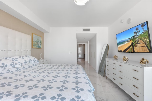 bedroom with marble finish floor and visible vents