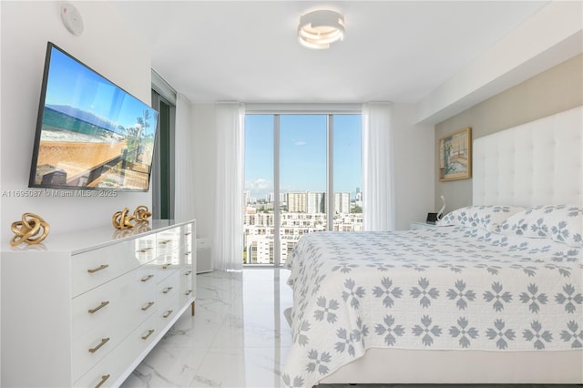 bedroom with expansive windows, marble finish floor, and access to outside